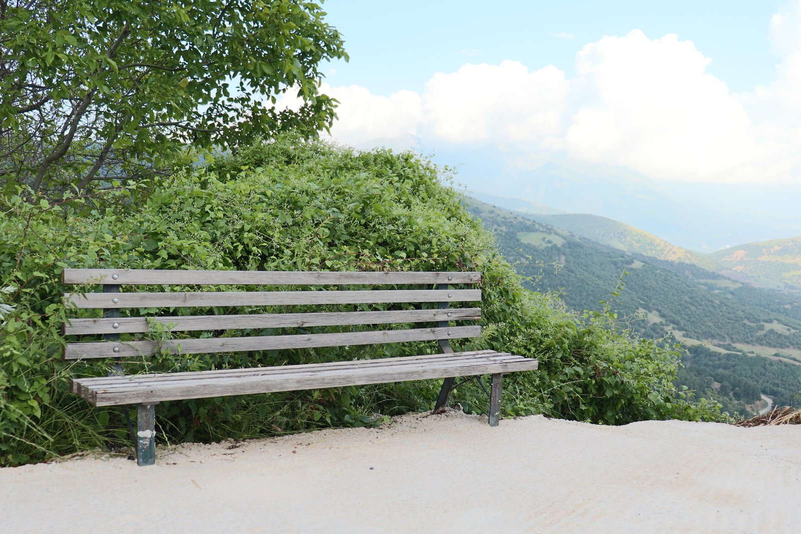 Sun-faded trail kiosk near the Lanari apiary