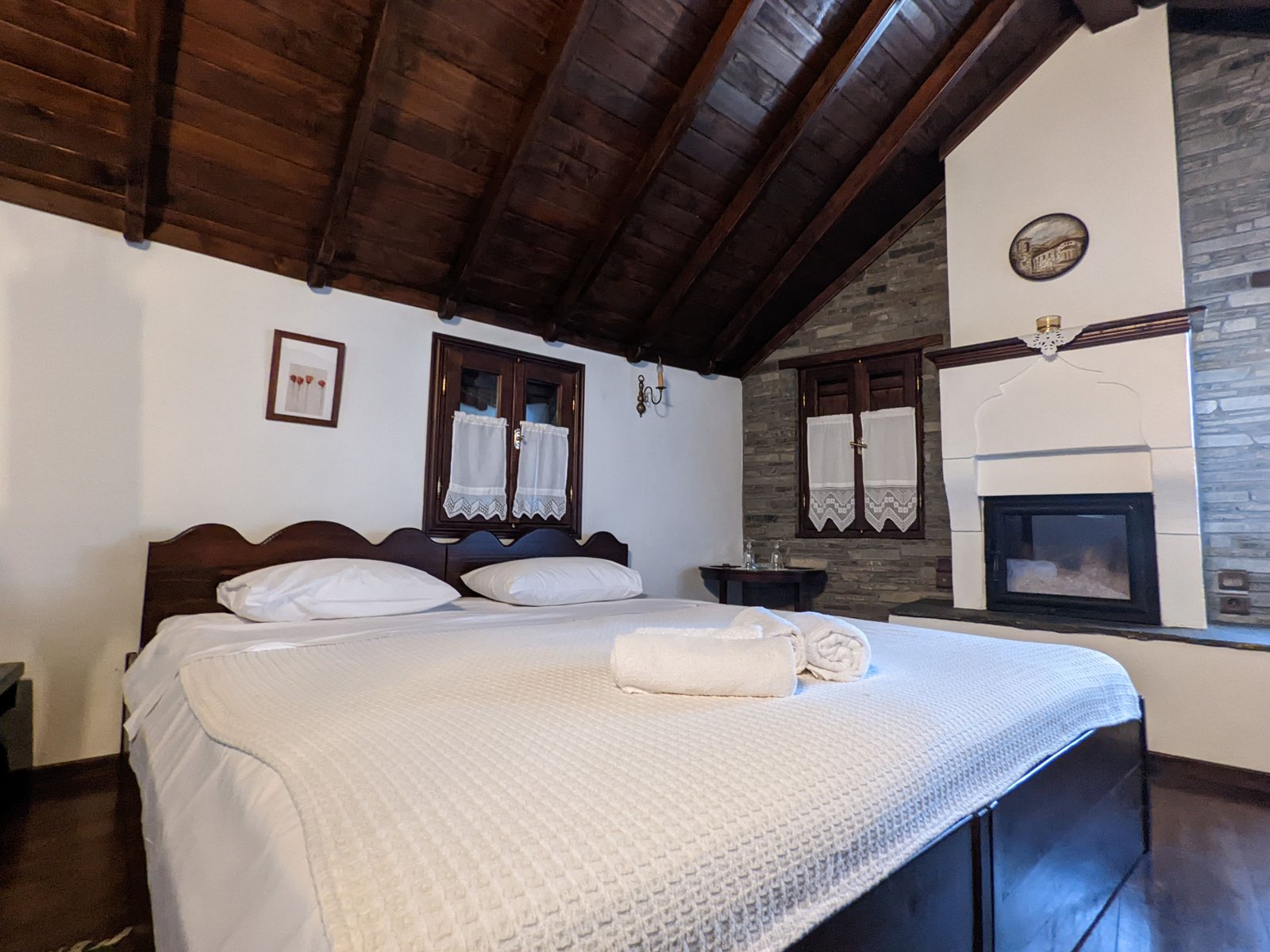 Elegant guesthouse bedroom with warm lighting and mountain views
