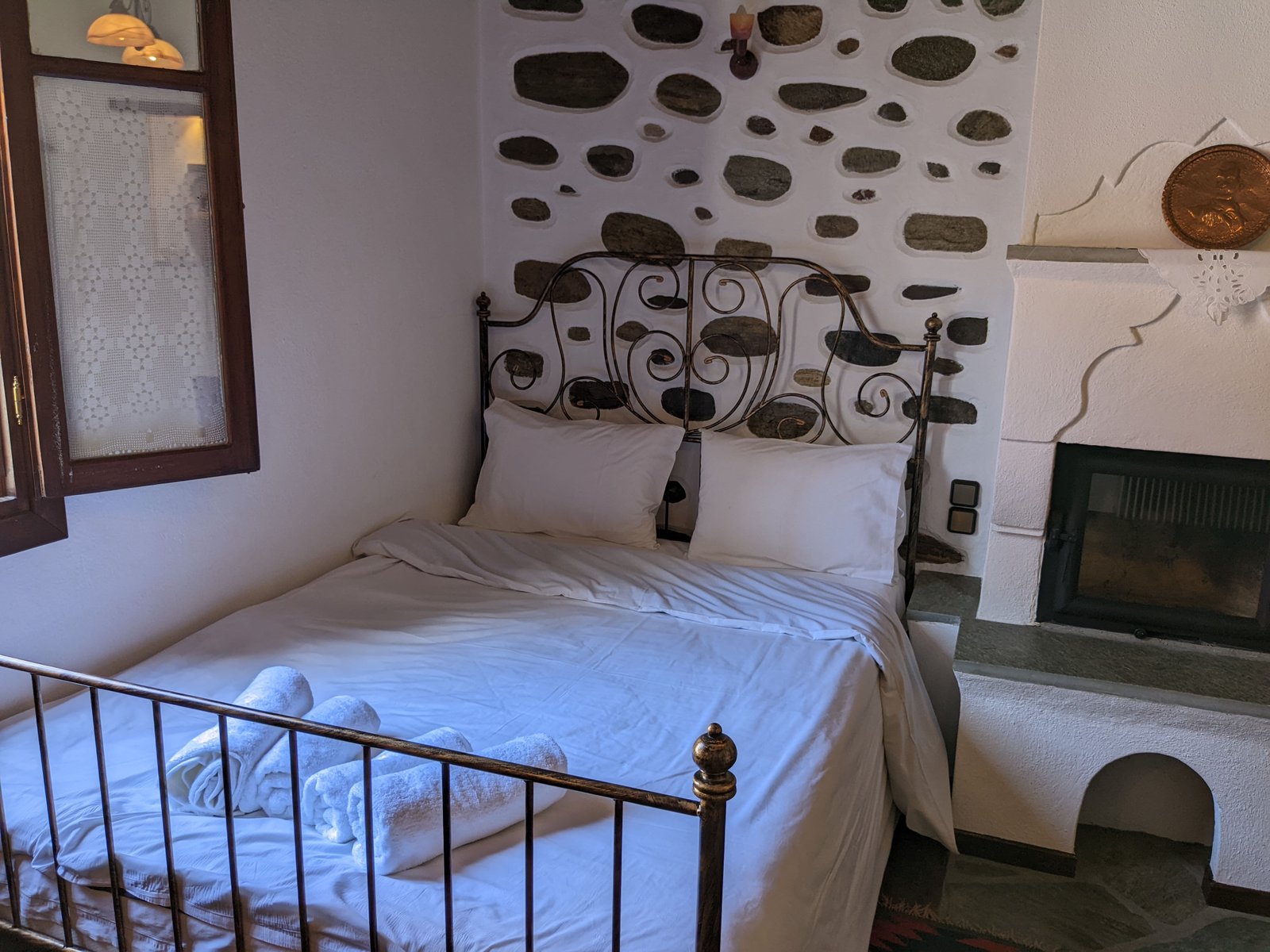 Cozy guest room with warm wood tones and comfortable furnishings
