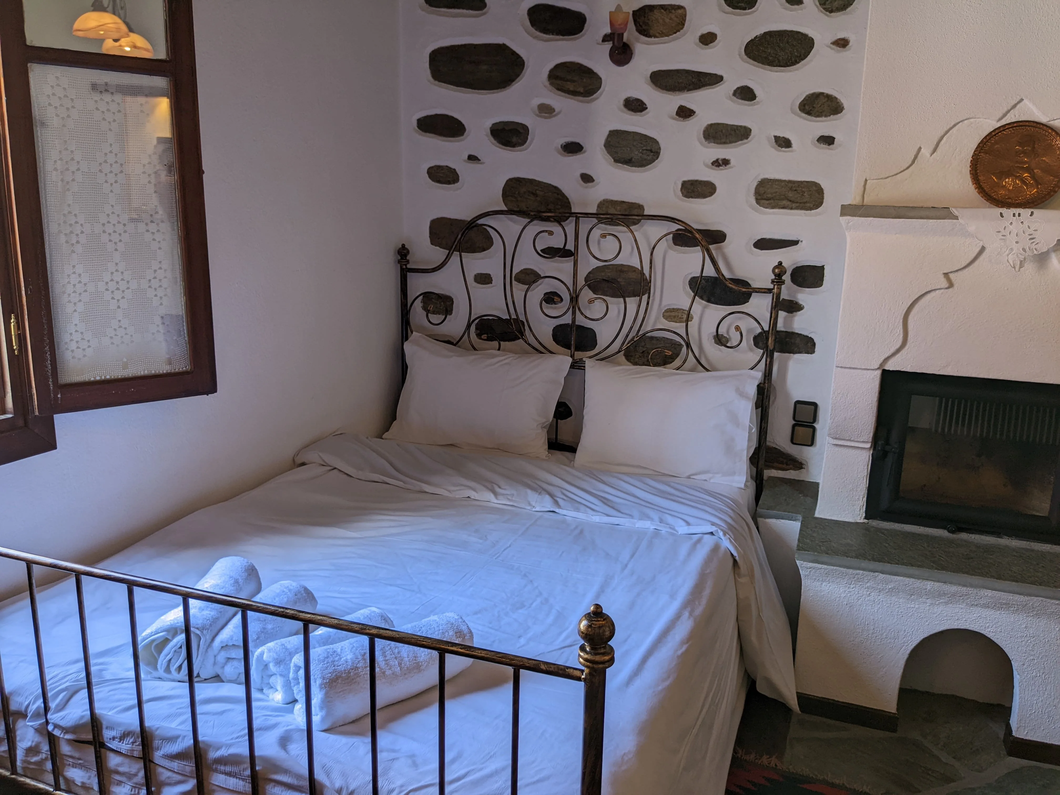 Cozy guest room with warm wood tones and comfortable furnishings