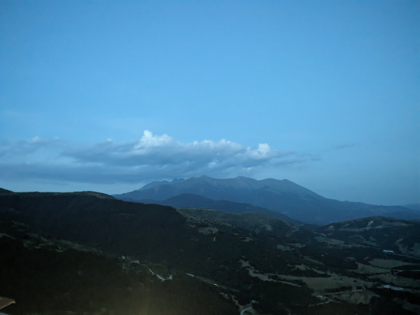 The Olympus ridge at blue hour, the kind of evening that follows a ski-touring day on Titaros