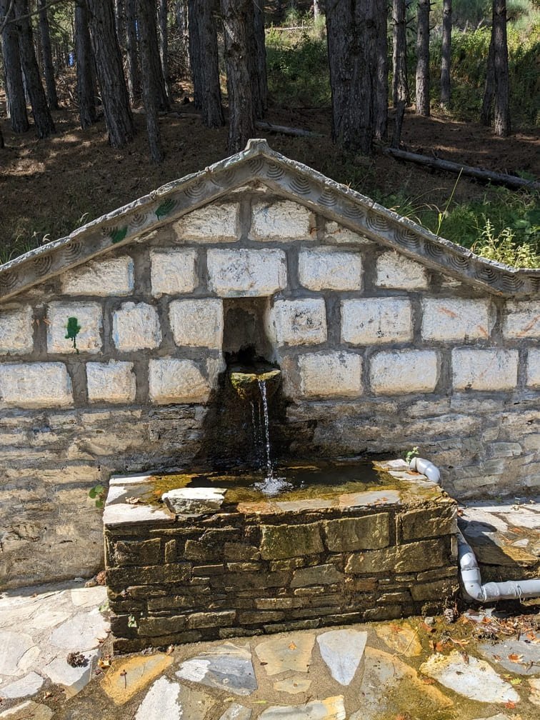 Traditional stone water fountain in Livadi village