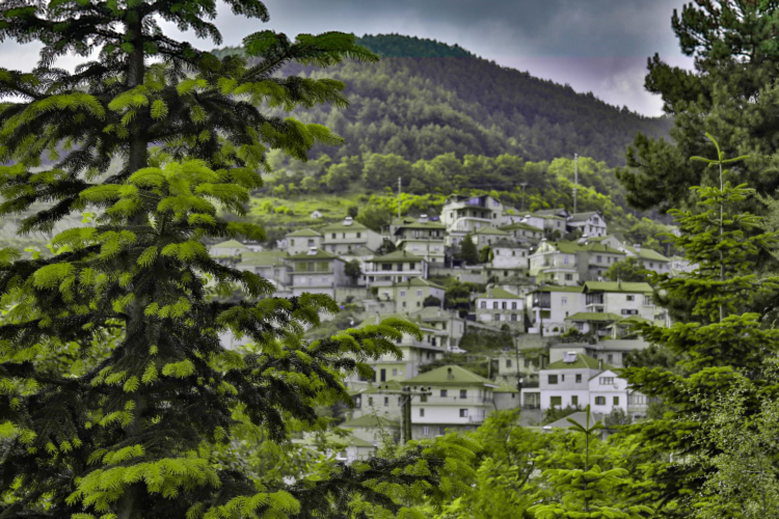 Lanari Guesthouse exterior surrounded by lush greenery in Livadi village